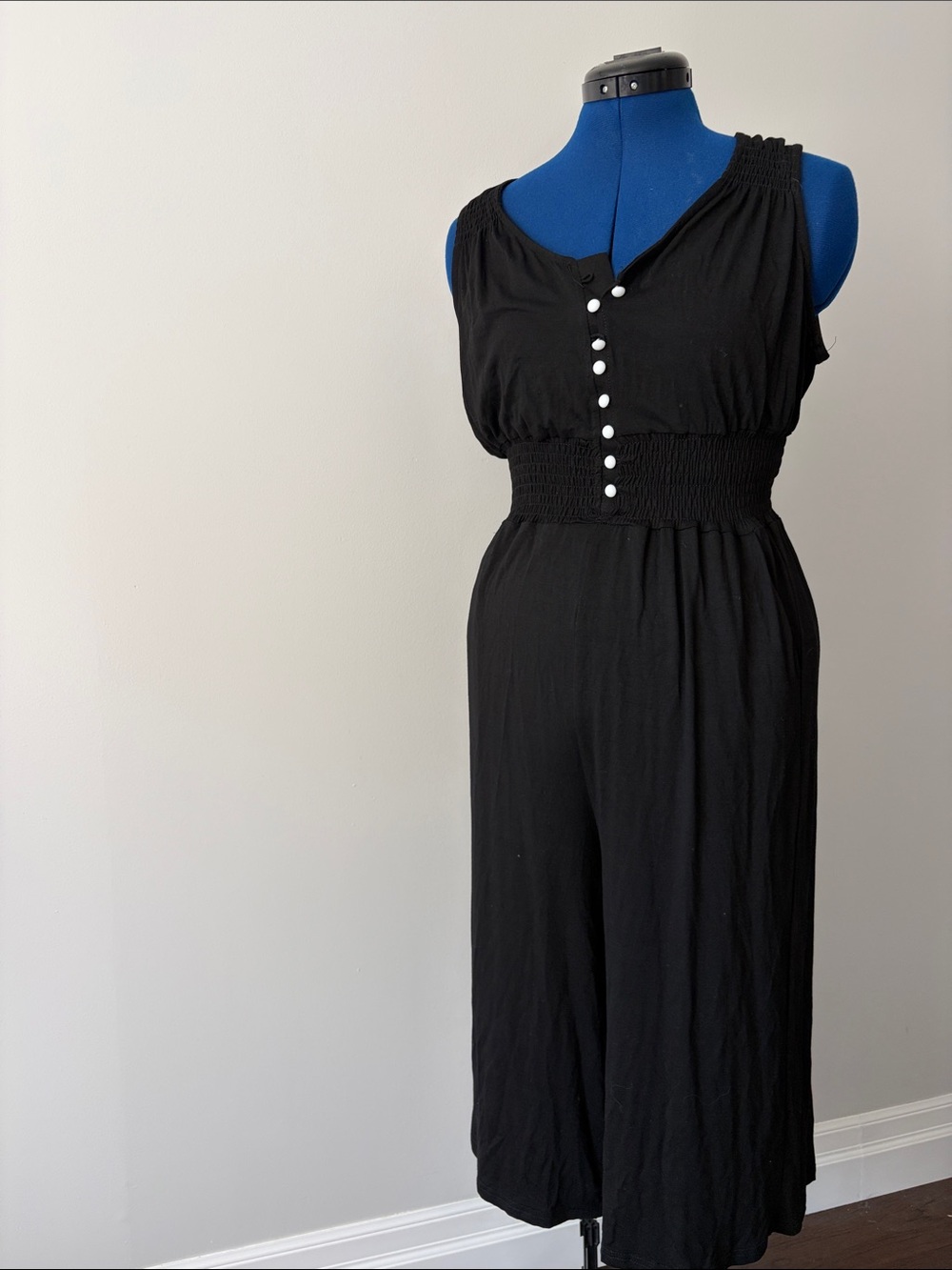 Sleeveless Black Smocked-Waist Jumpsuit with Button Detail